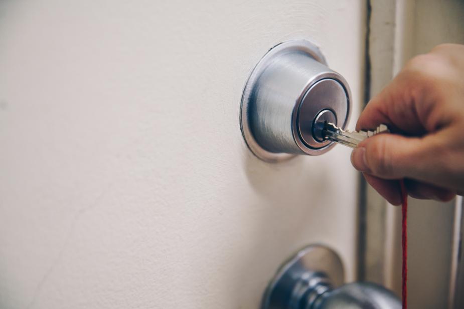 residential locksmith unlocking door