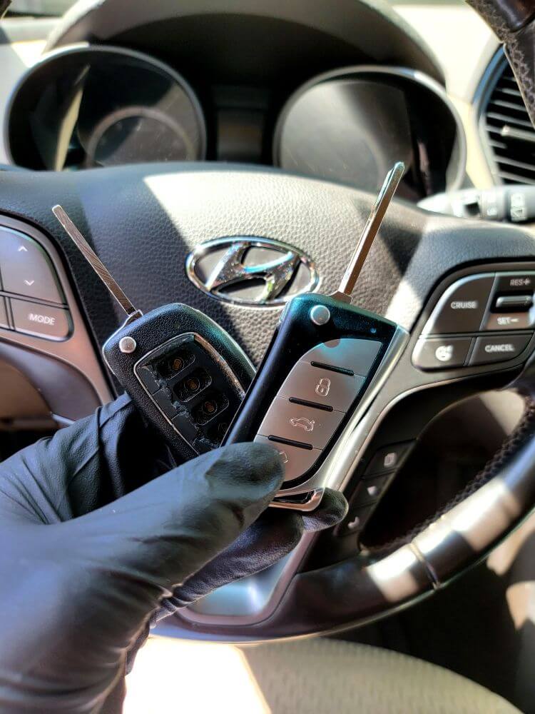 The old key fob was replaced for the 2013 Hyundai Santa Fe by the auto locksmith Car Key Guy.